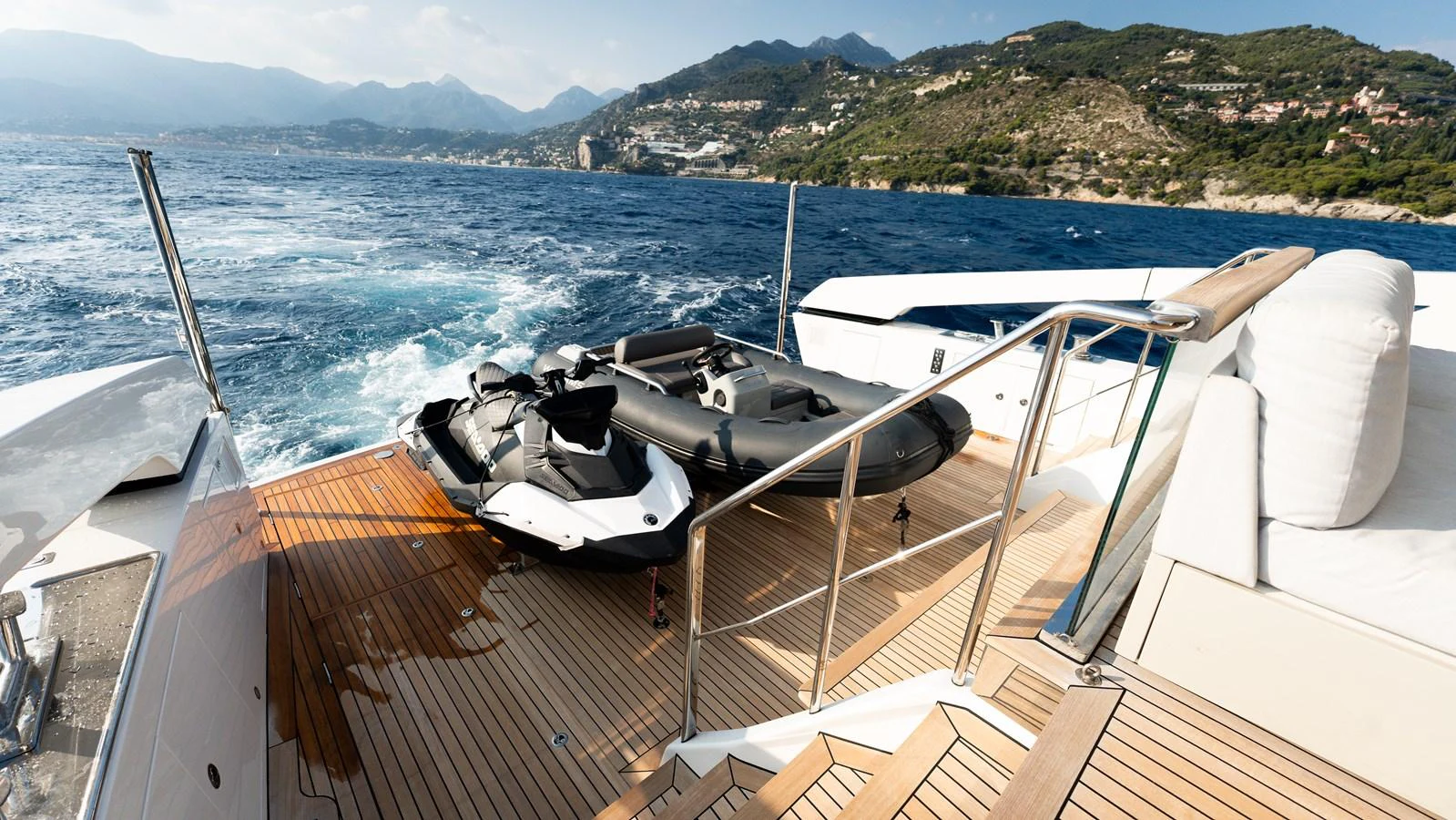 The aft deck features a jet ski and a tender, perfect for water activities. aboard LA Yacht for Sale