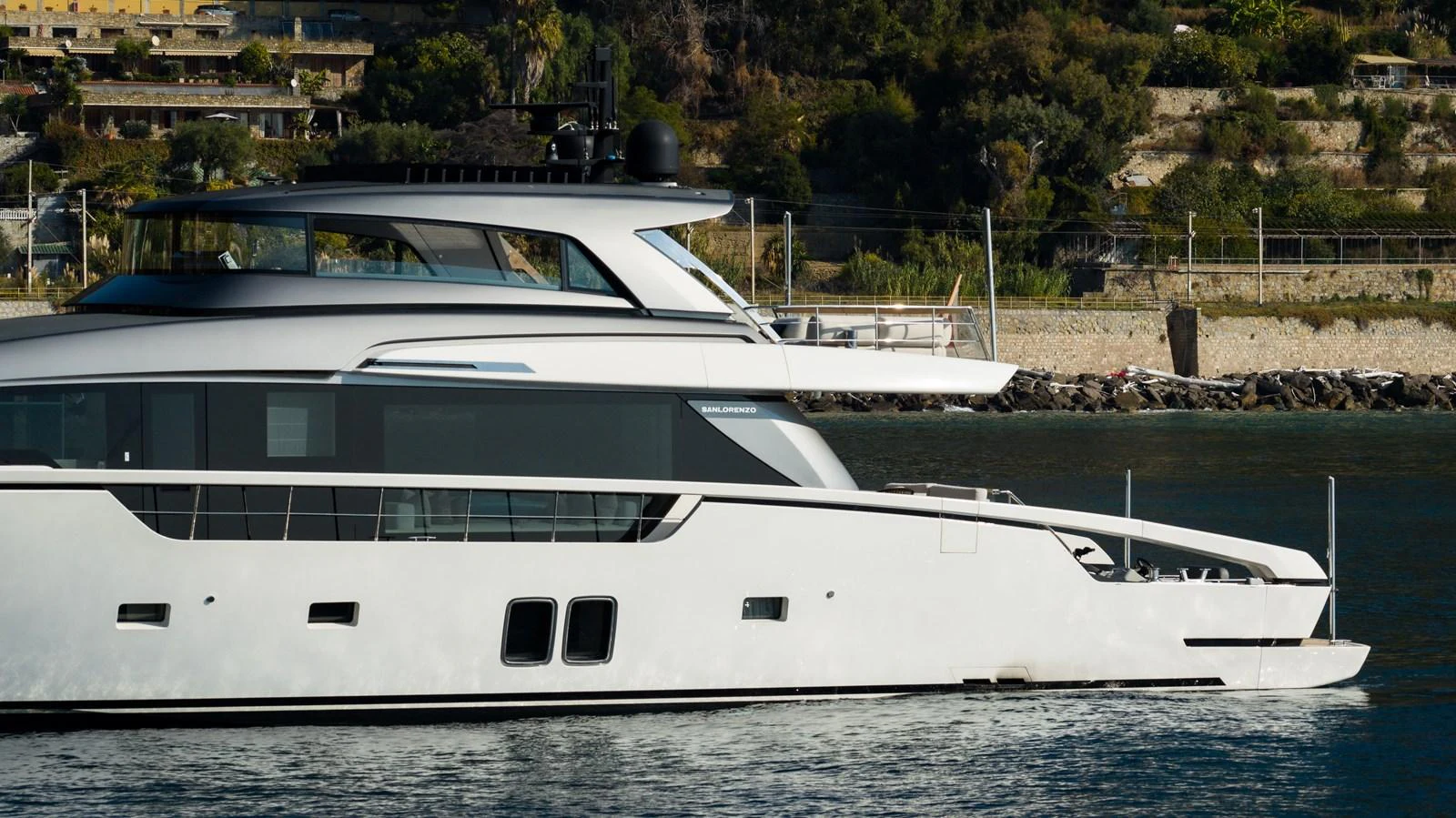 A sleek and modern yacht cruising along a scenic coastline. aboard LA Yacht for Sale