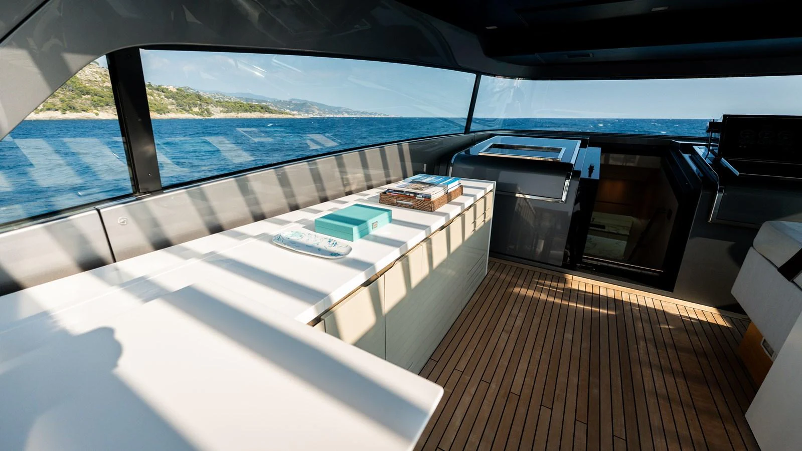 The yacht's interior features a sleek and modern design with expansive windows offering stunning sea views. aboard LA Yacht for Sale