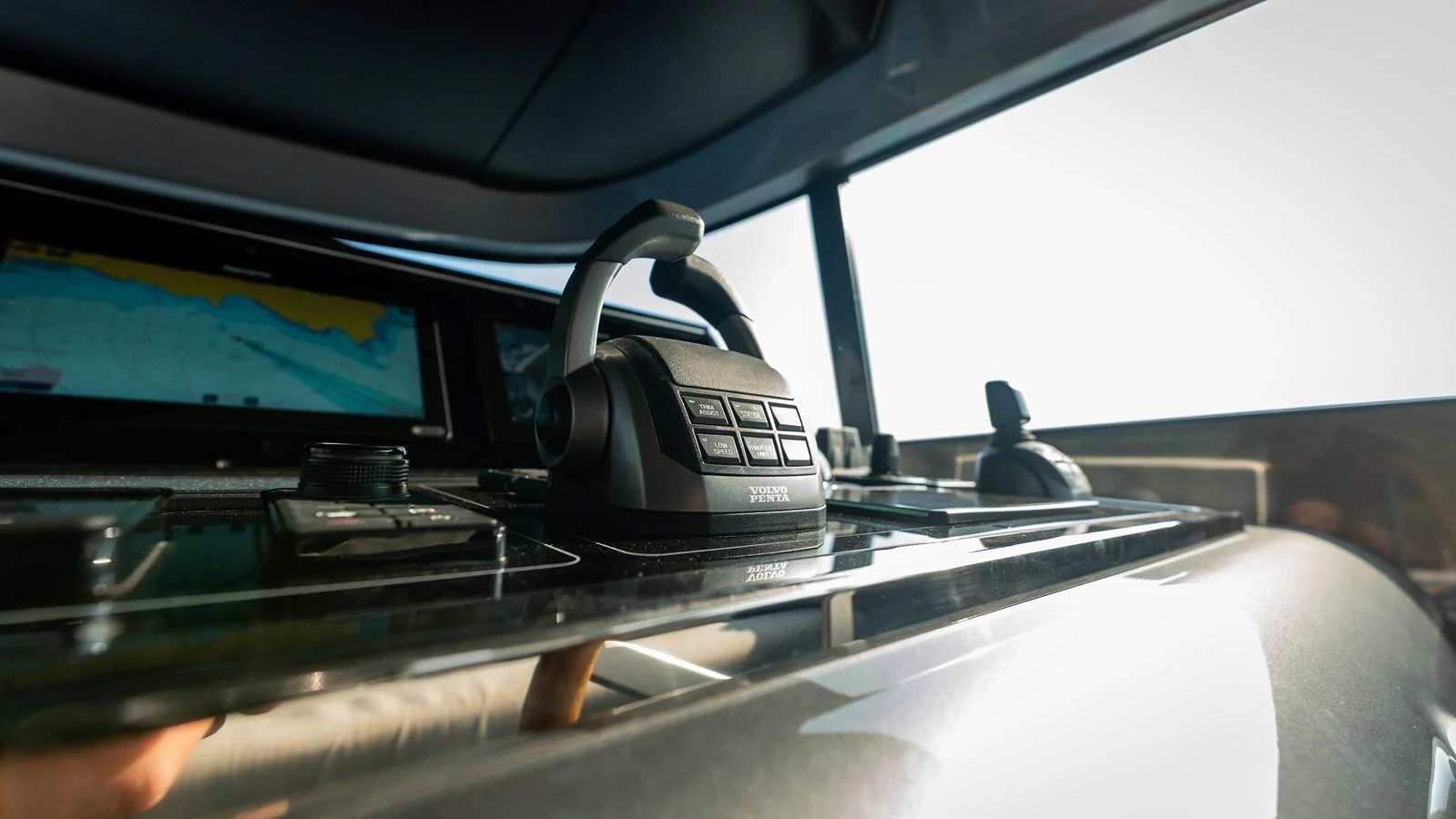 A close-up view of the yacht's helm station showcasing modern navigation equipment. aboard LA Yacht for Sale
