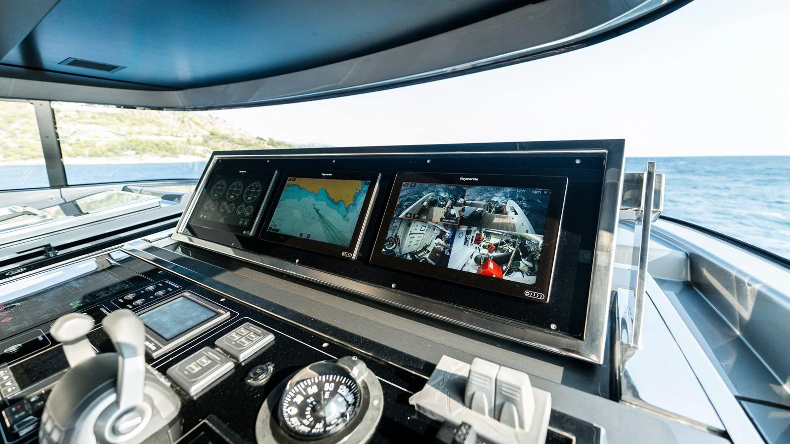 The helm station features advanced navigation and control systems with a panoramic view of the sea. aboard LA Yacht for Sale