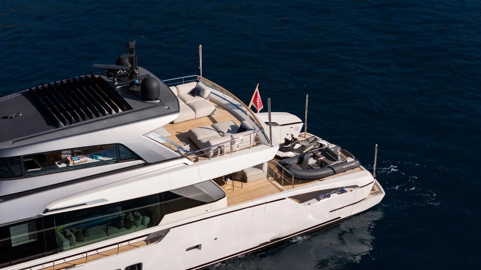 The yacht's aft deck offers luxurious lounging areas with stunning views over the water. aboard LA Yacht for Sale