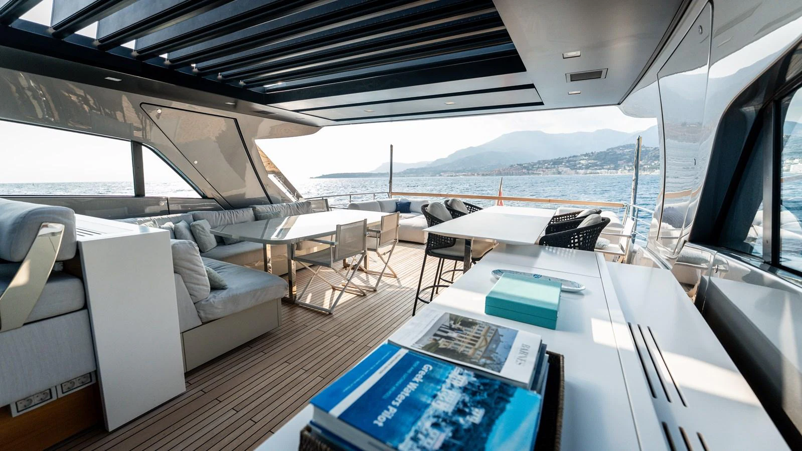 The aft deck offers a spacious and luxurious outdoor seating area with panoramic views. aboard LA Yacht for Sale
