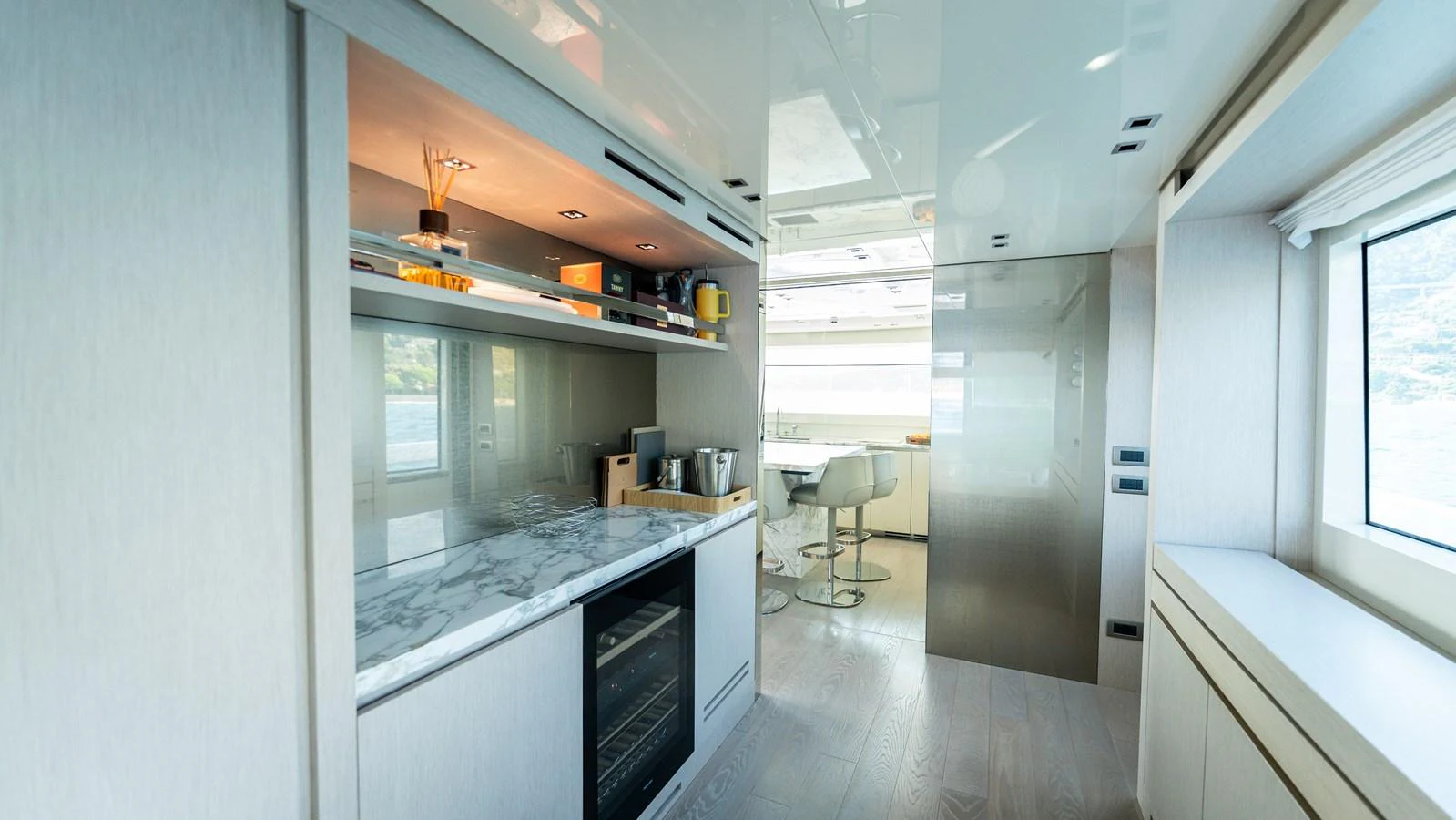 The yacht's galley features modern appliances and sleek design for a luxurious culinary experience. aboard LA Yacht for Sale