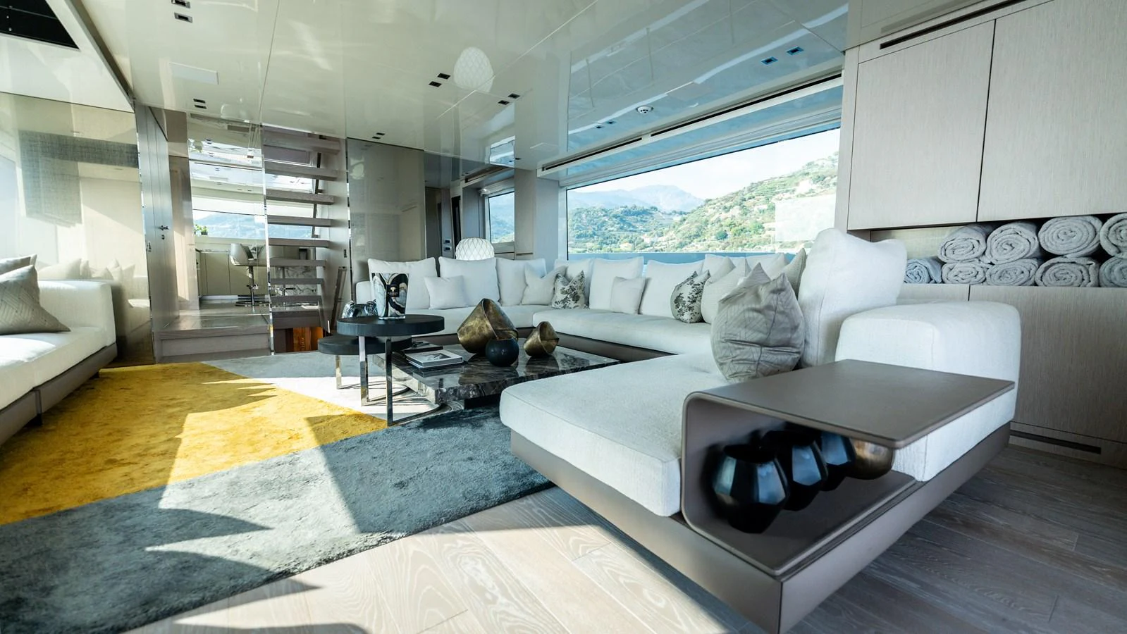 The salon features a spacious and modern design with ample seating and elegant decor. aboard LA Yacht for Sale