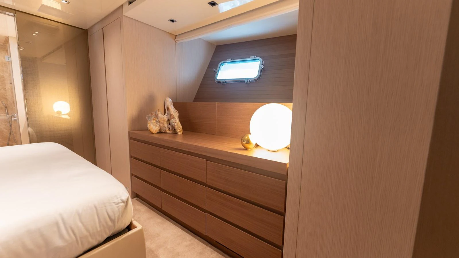 The stateroom features elegant wood paneling and a cozy ambiance. aboard LA Yacht for Sale