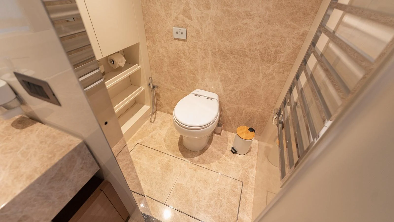The yacht's bathroom features elegant marble surfaces and modern fixtures. aboard LA Yacht for Sale
