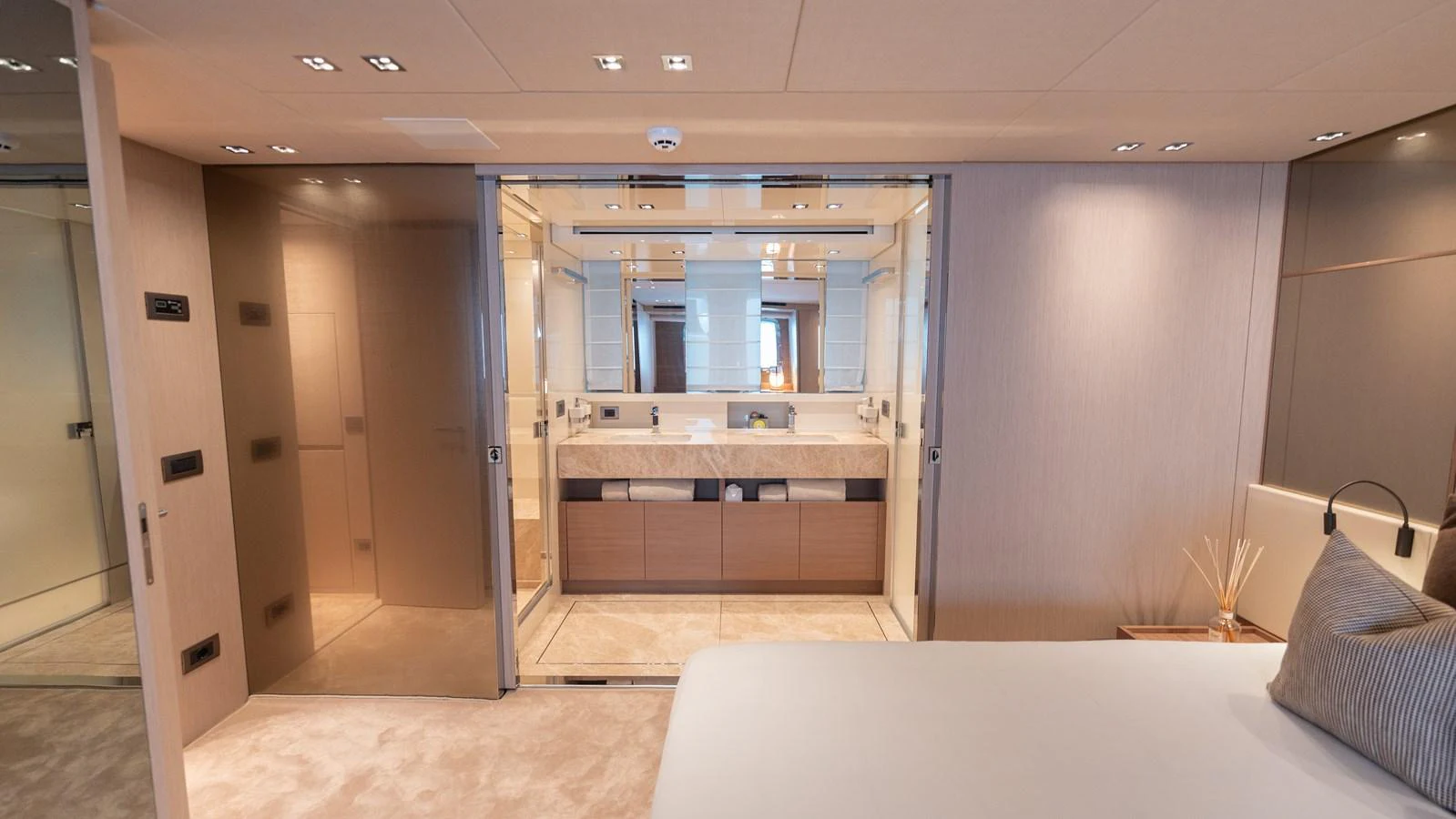 The master stateroom features a luxurious ensuite bathroom with modern fixtures and ample lighting. aboard LA Yacht for Sale