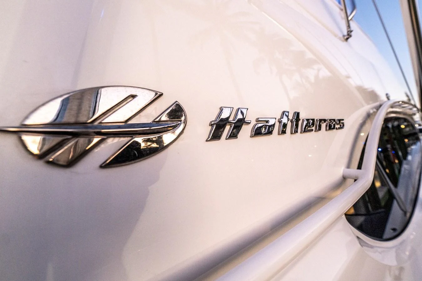 A close-up view of the Hatteras logo on the yacht's exterior. aboard REEL TEXAN Yacht for Sale