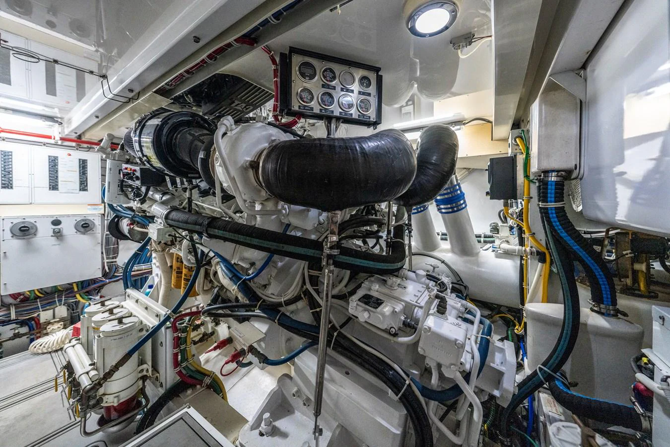 The engine room showcases the yacht's powerful and meticulously maintained machinery. aboard REEL TEXAN Yacht for Sale