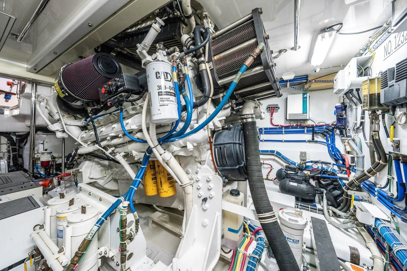 The image showcases the intricate and well-maintained engine room of the yacht. aboard REEL TEXAN Yacht for Sale