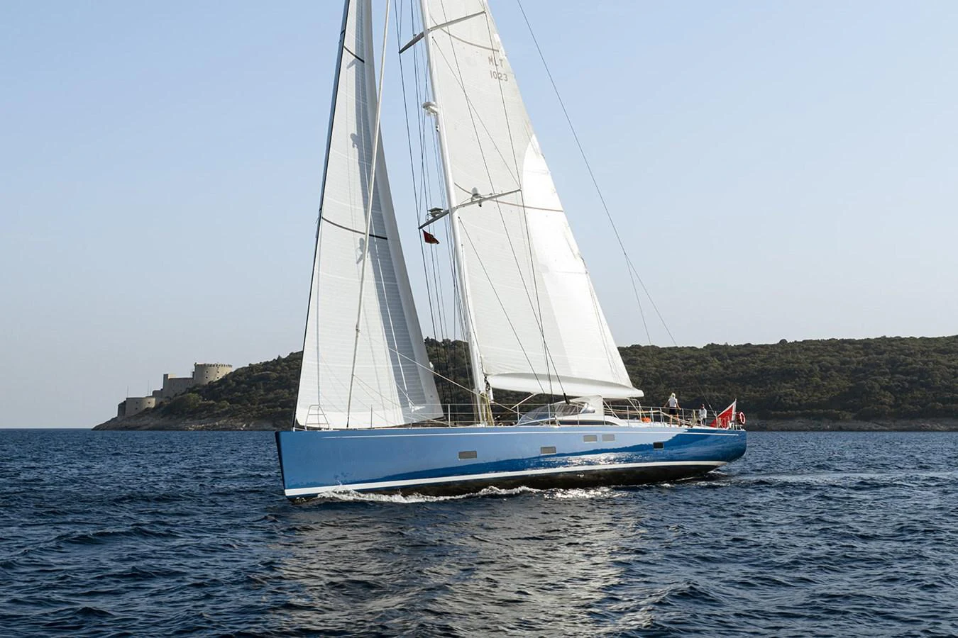 A sleek sailing yacht glides gracefully on the open water, showcasing its elegant design and expansive sails. aboard FARFALLA Yacht for Sale