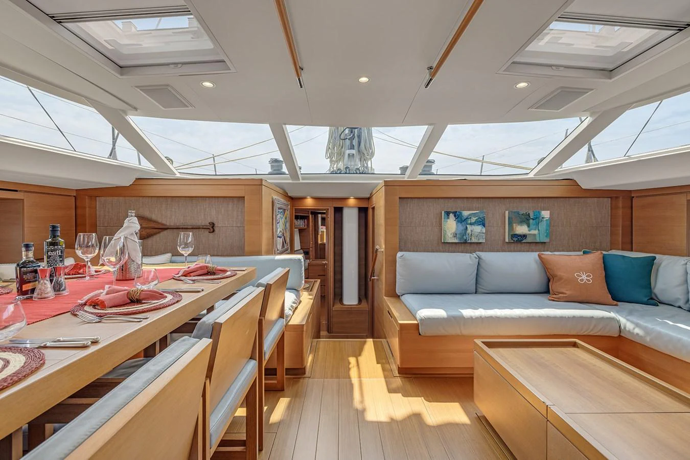 The yacht's salon features a spacious and well-lit area with comfortable seating and a dining table. aboard FARFALLA Yacht for Sale