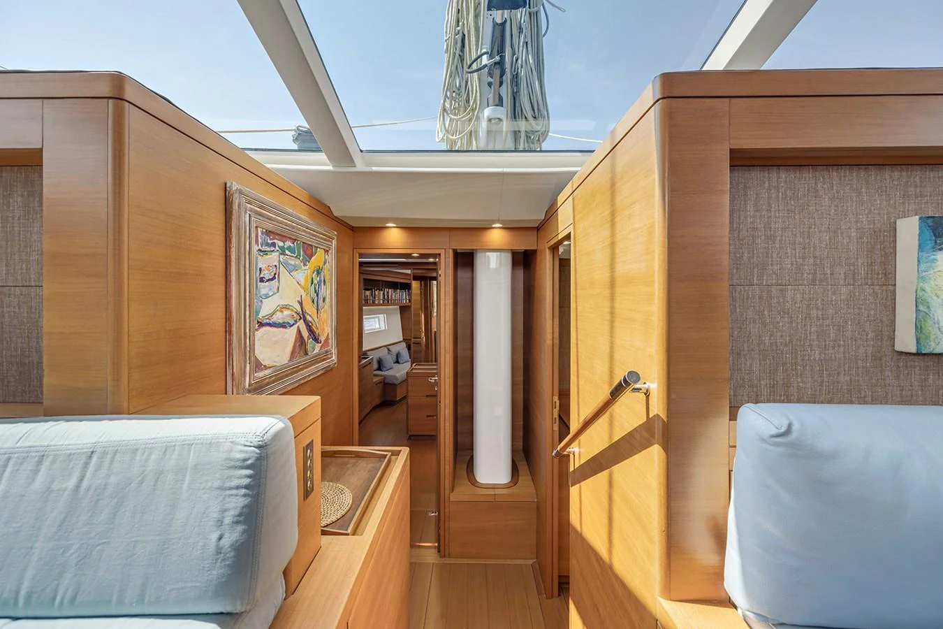 The yacht's interior features a cozy and well-lit hallway with wooden finishes and modern decor. aboard FARFALLA Yacht for Sale