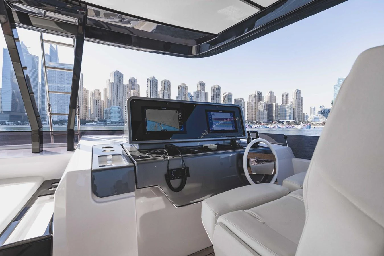 The helm station offers a sleek and modern command center with advanced navigation equipment and comfortable seating. aboard CYRUS Yacht for Sale