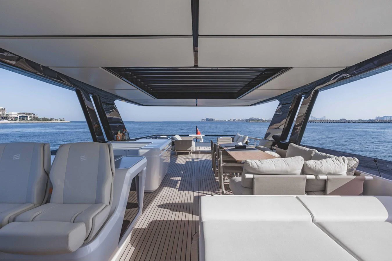 The aft deck offers a spacious and luxurious outdoor living area with comfortable seating and stunning views of the water. aboard CYRUS Yacht for Sale