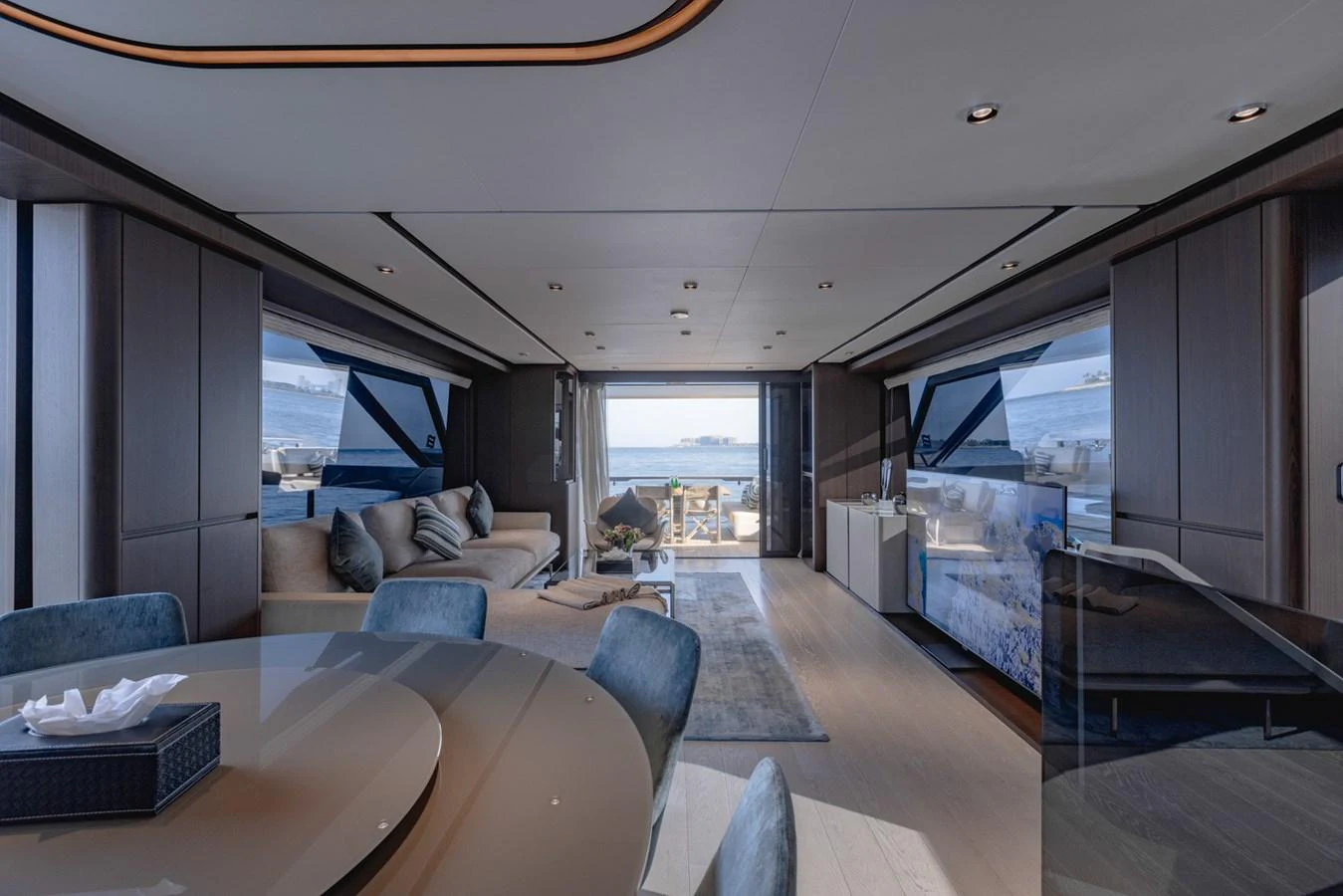 The yacht's salon features modern furnishings with expansive windows offering stunning sea views. aboard CYRUS Yacht for Sale