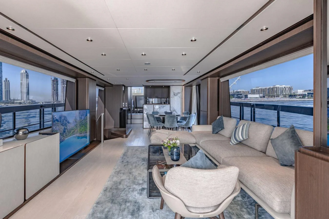The spacious salon features elegant furnishings and panoramic windows offering stunning views. aboard CYRUS Yacht for Sale