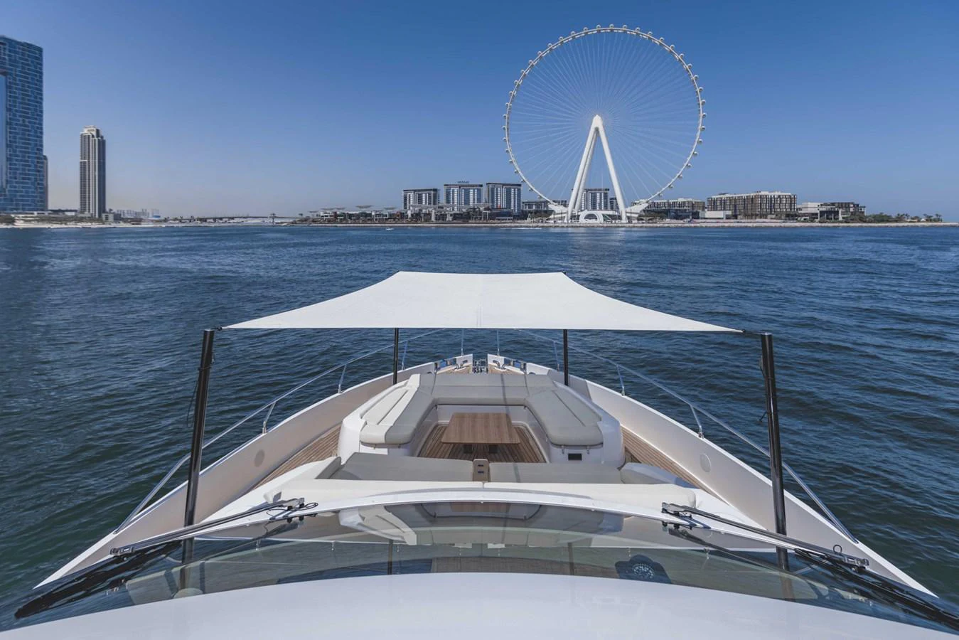 The yacht's bow offers a spacious seating area with a sunshade, perfect for enjoying scenic views. aboard CYRUS Yacht for Sale