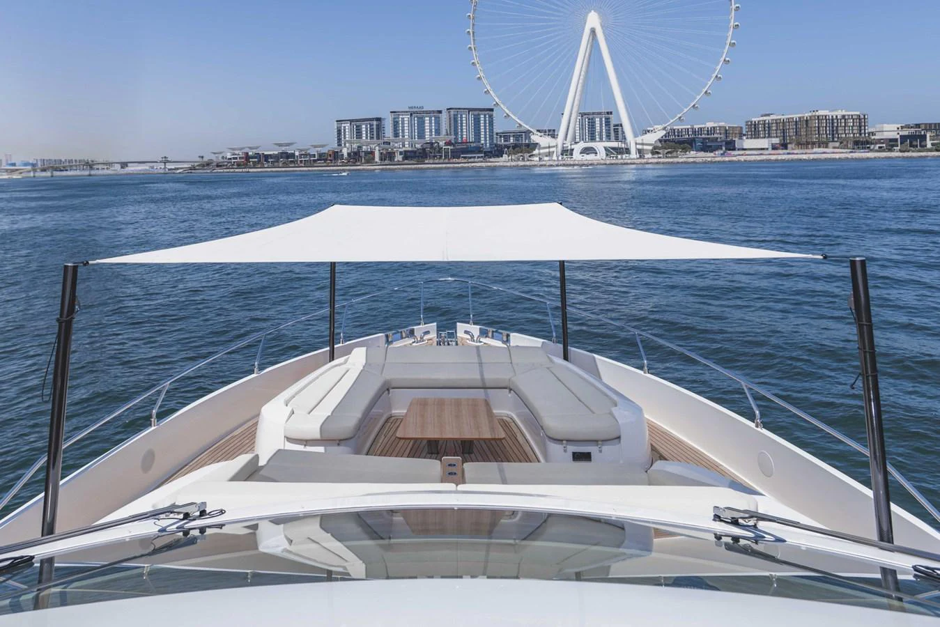The yacht's bow features a spacious seating area with a retractable sunshade, perfect for enjoying panoramic views. aboard CYRUS Yacht for Sale