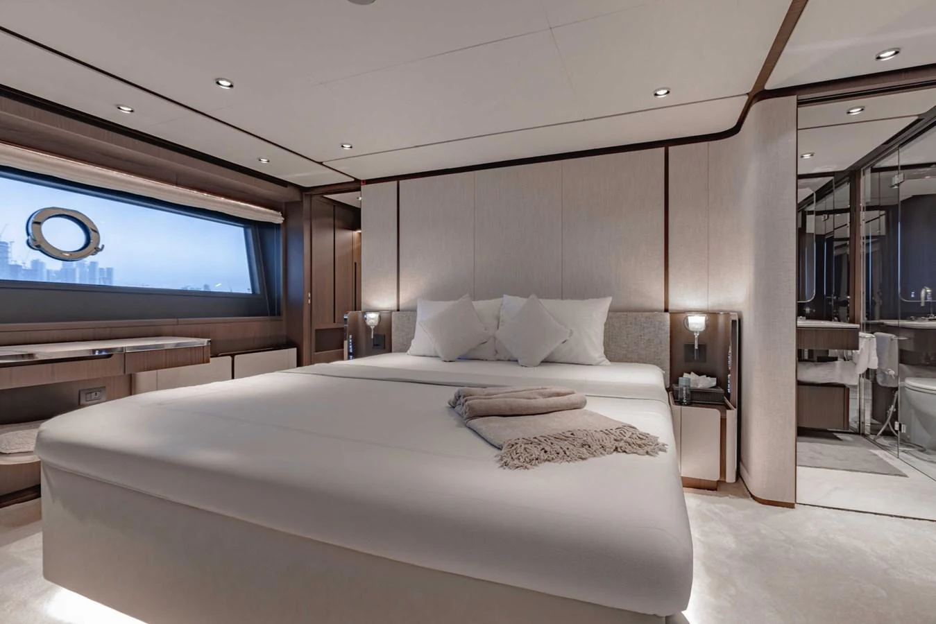 The master stateroom features a spacious bed with elegant decor and ample natural light. aboard CYRUS Yacht for Sale