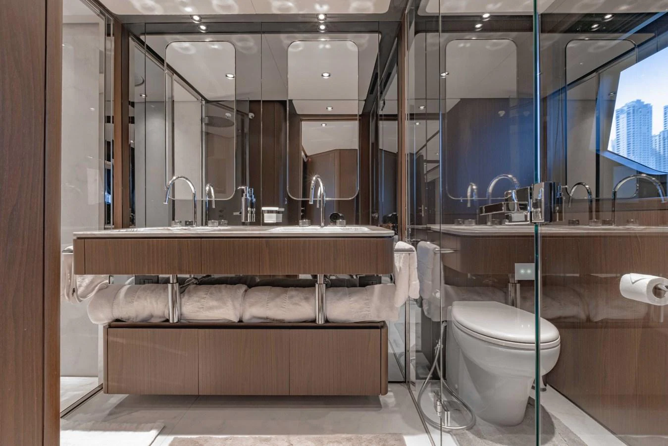 The yacht's bathroom features modern fixtures and a sleek design with ample mirrors and glass accents. aboard CYRUS Yacht for Sale
