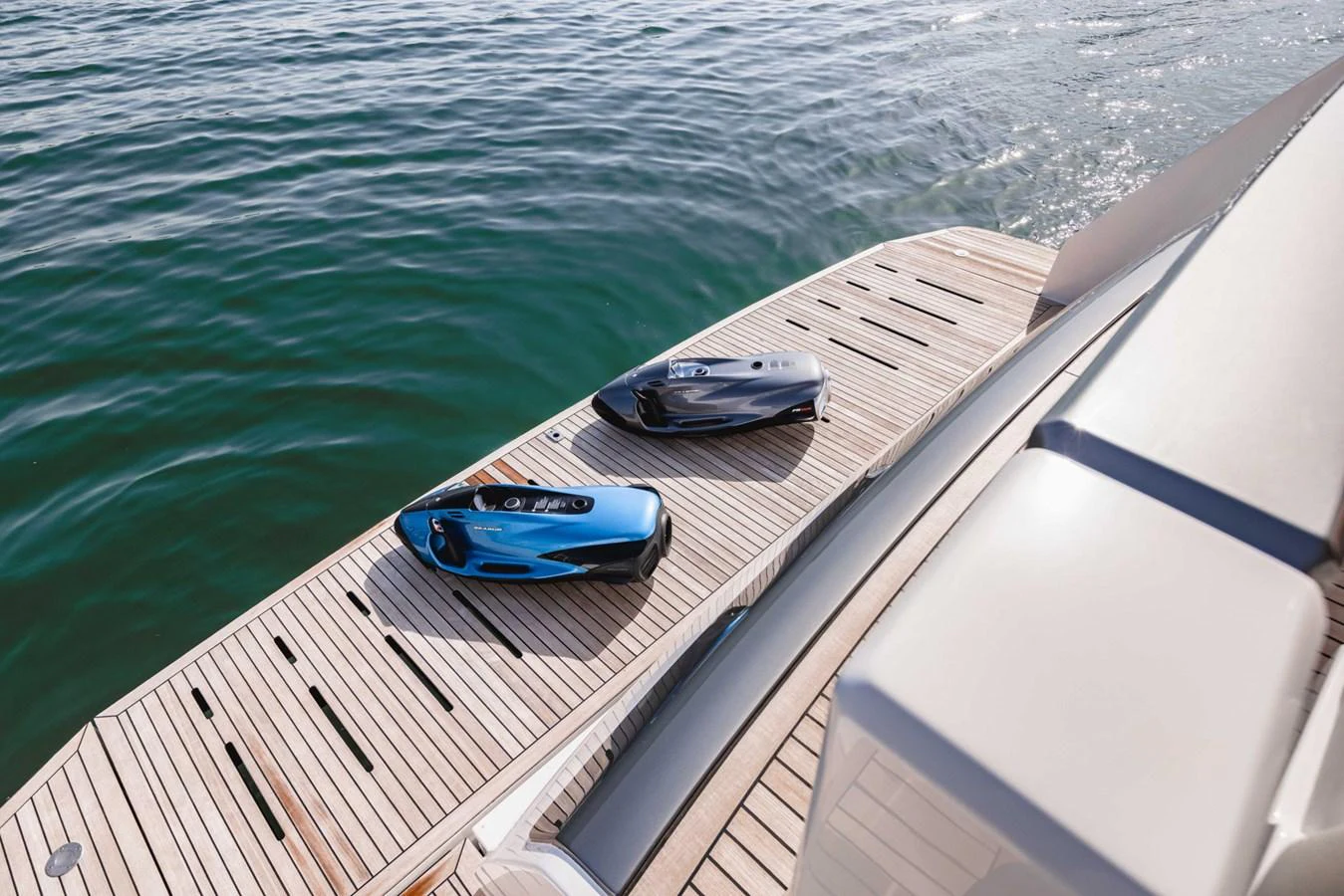 The yacht features a spacious swim platform with two sleek sea scooters, perfect for water adventures. aboard CYRUS Yacht for Sale
