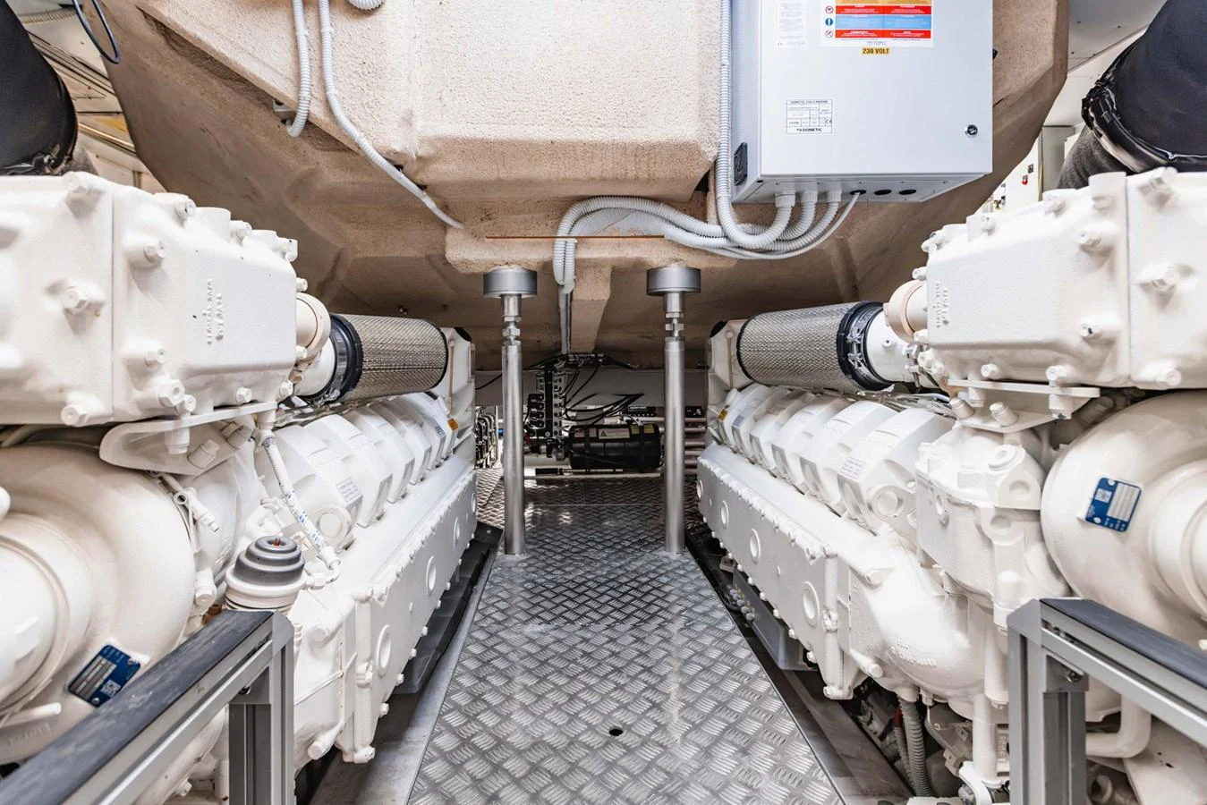 The image showcases the pristine engine room of the yacht, highlighting its powerful machinery. aboard CYRUS Yacht for Sale