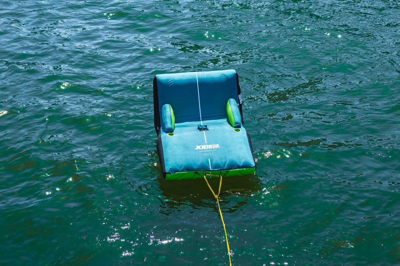 A floating water toy is tethered in the water, ready for fun and relaxation. aboard CYRUS Yacht for Sale