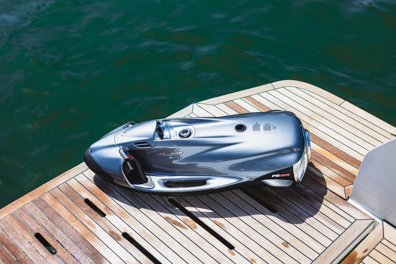 A sleek, modern water toy is showcased on the yacht's deck, ready for aquatic adventures. aboard CYRUS Yacht for Sale
