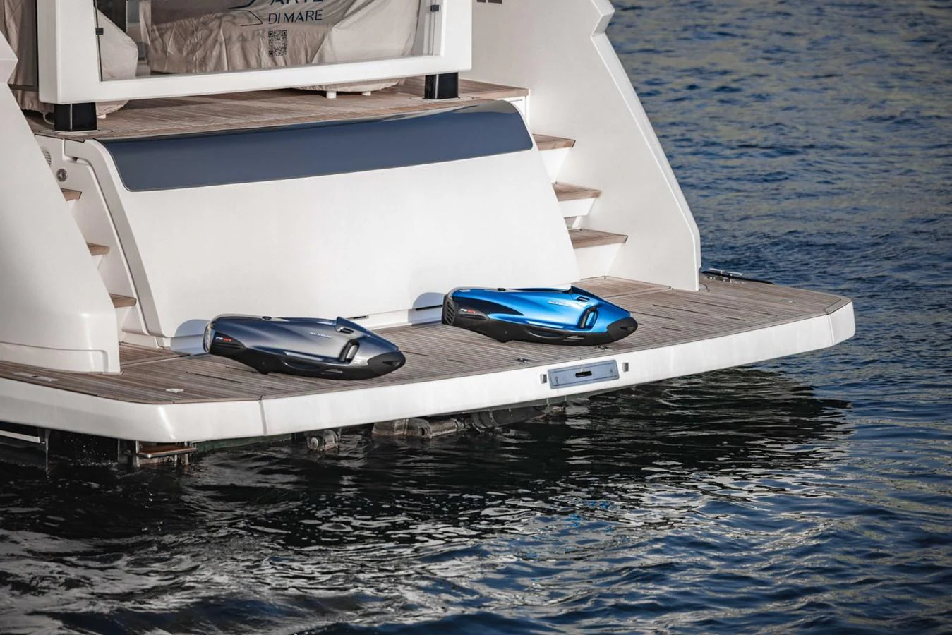 The yacht's swim platform features two sleek, modern sea scooters for underwater exploration. aboard CYRUS Yacht for Sale