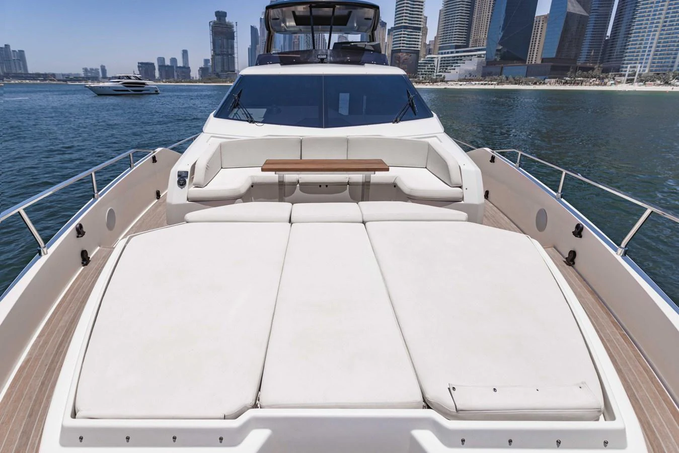 The yacht's foredeck features spacious sun pads and a comfortable seating area, perfect for relaxation while enjoying the view. aboard BELLA III Yacht for Sale