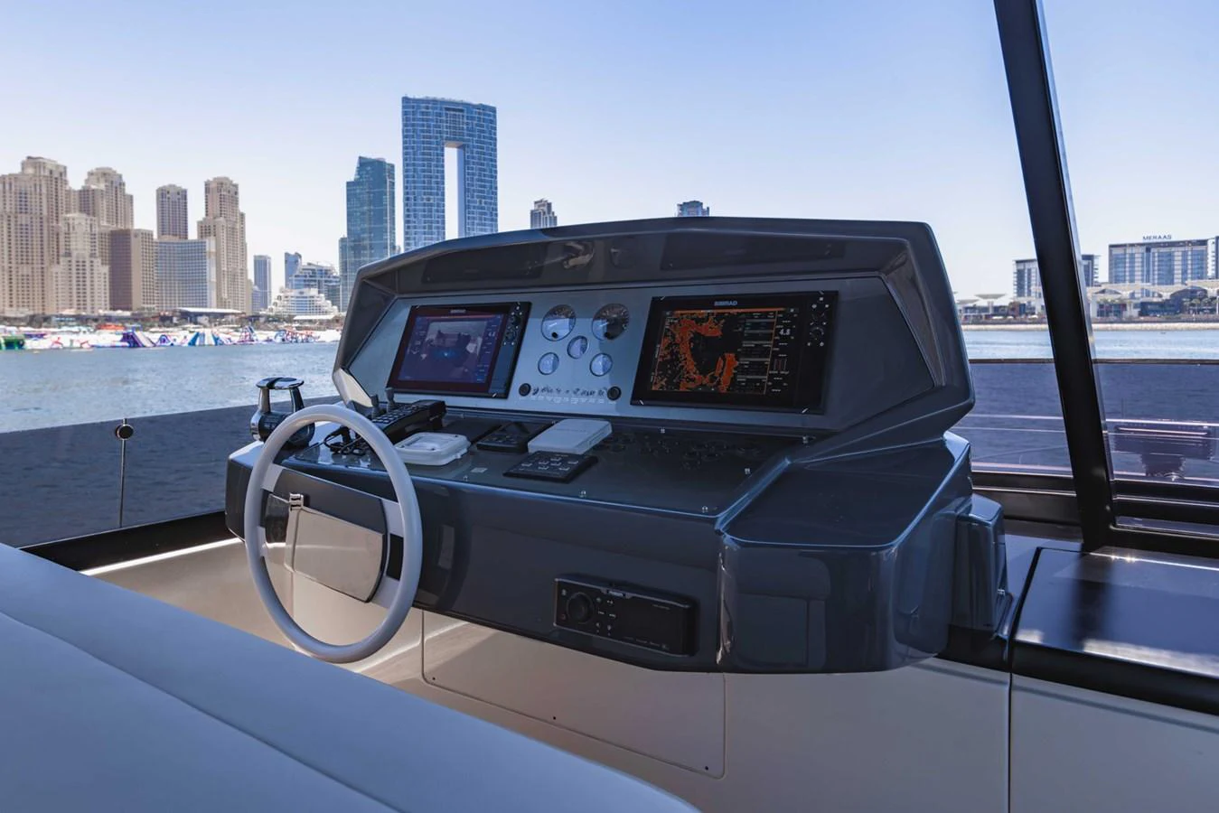 The helm station offers a commanding view with advanced navigation equipment and a sleek design. aboard BELLA III Yacht for Sale