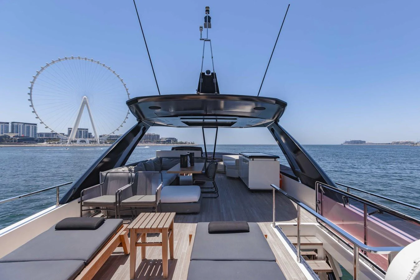 The yacht's sundeck offers a luxurious outdoor space with ample seating and stunning views. aboard BELLA III Yacht for Sale
