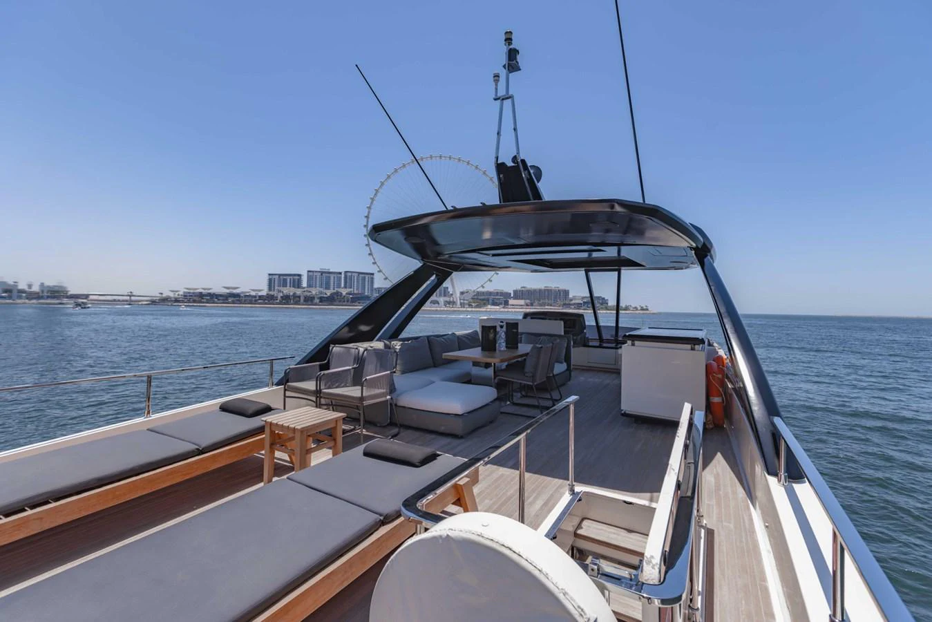 The flybridge offers a spacious and luxurious outdoor lounging area with panoramic ocean views. aboard BELLA III Yacht for Sale