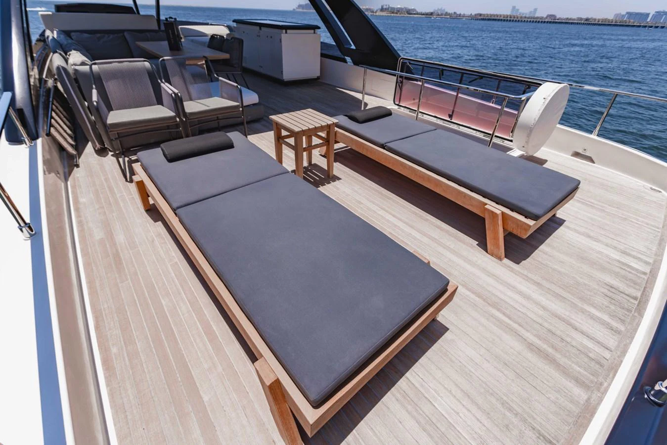 The sundeck features luxurious sun loungers with a stunning view of the sea. aboard BELLA III Yacht for Sale