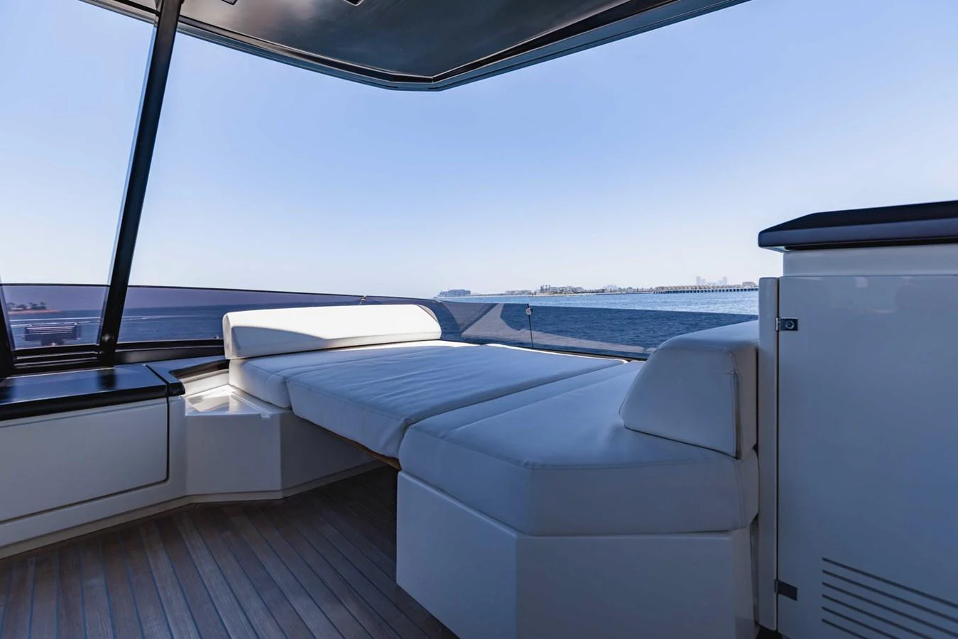 The sundeck offers a comfortable lounging area with panoramic sea views. aboard BELLA III Yacht for Sale