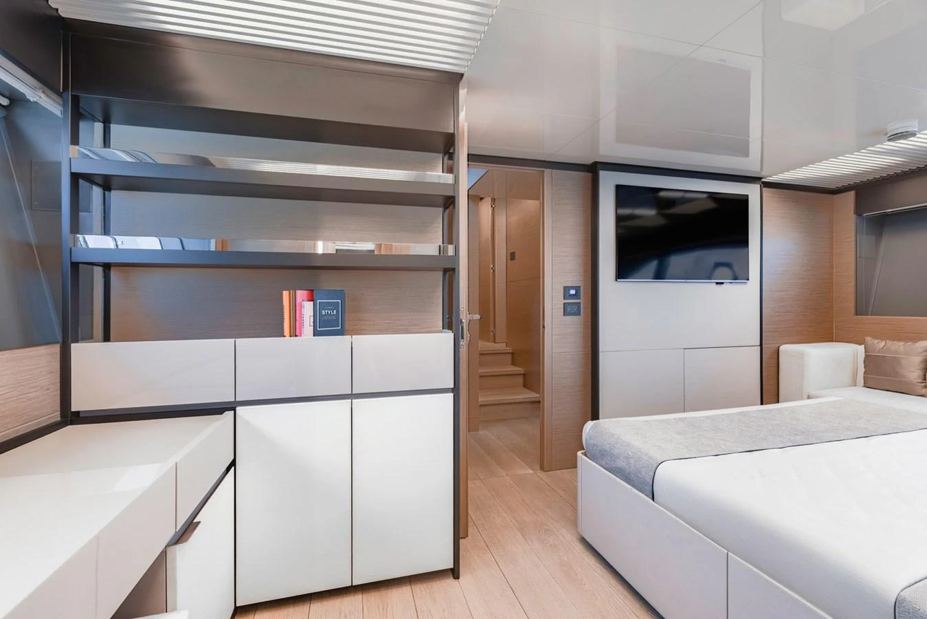 The stateroom features modern furnishings with a sleek design and ample natural light. aboard BELLA III Yacht for Sale
