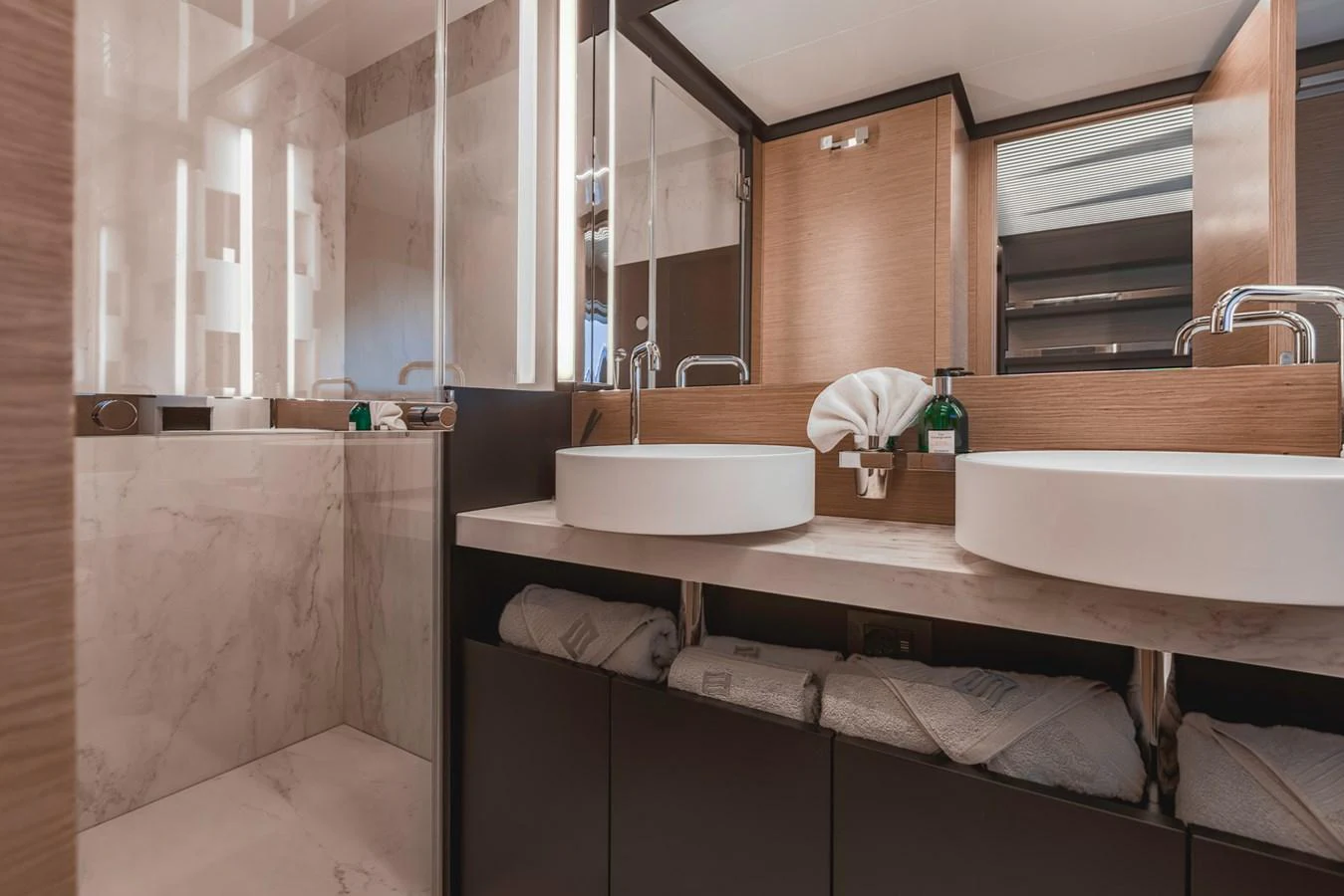 The yacht's bathroom features modern fixtures and a luxurious marble finish. aboard BELLA III Yacht for Sale