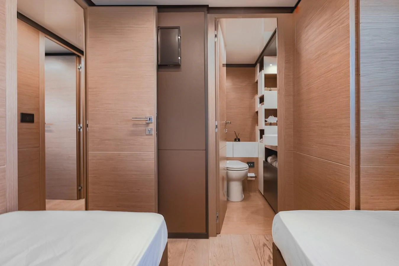 The guest cabin features twin beds and an ensuite bathroom with modern fixtures. aboard BELLA III Yacht for Sale