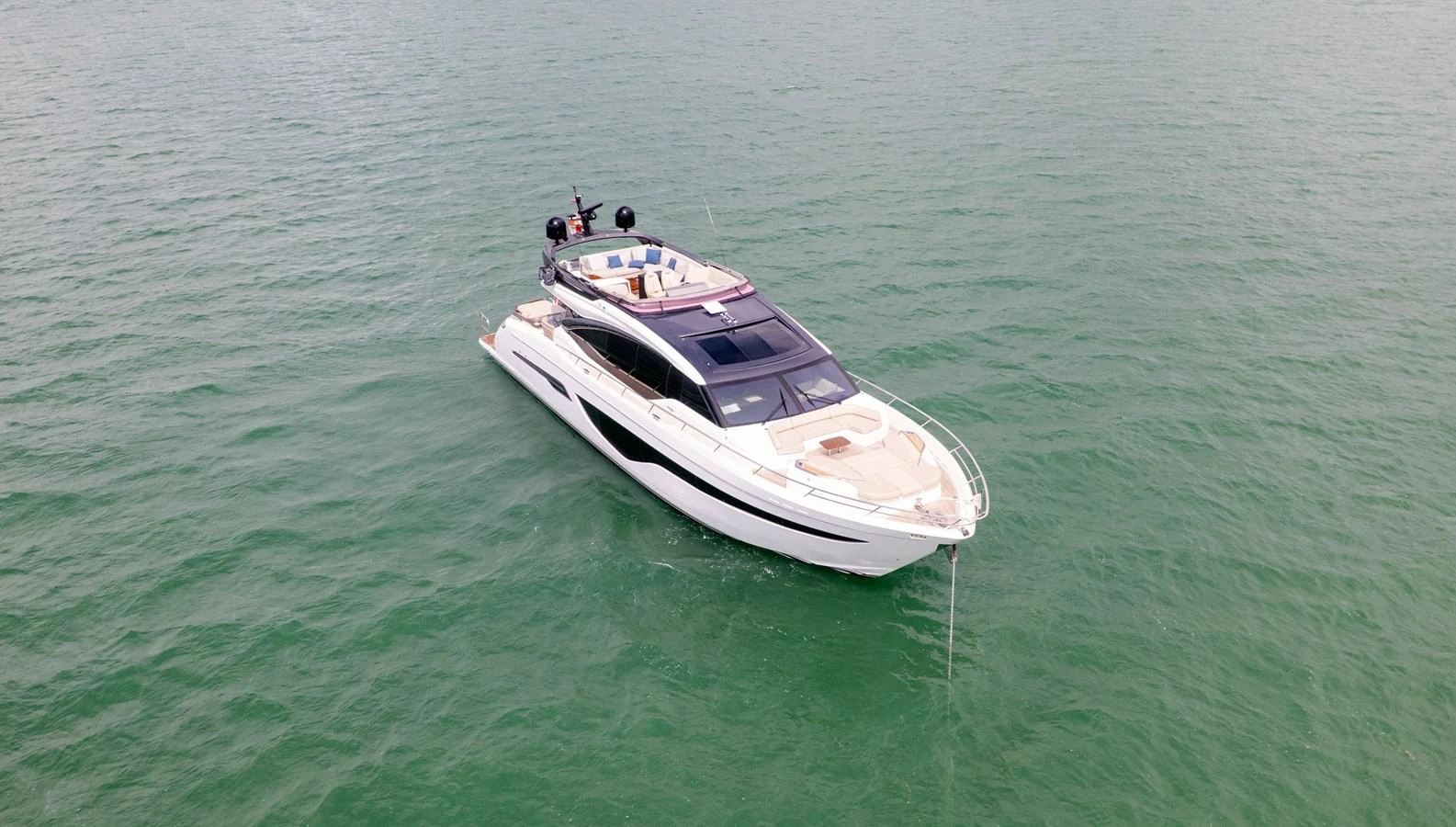 A sleek and modern yacht glides gracefully on calm waters. aboard PARAGON Yacht for Sale