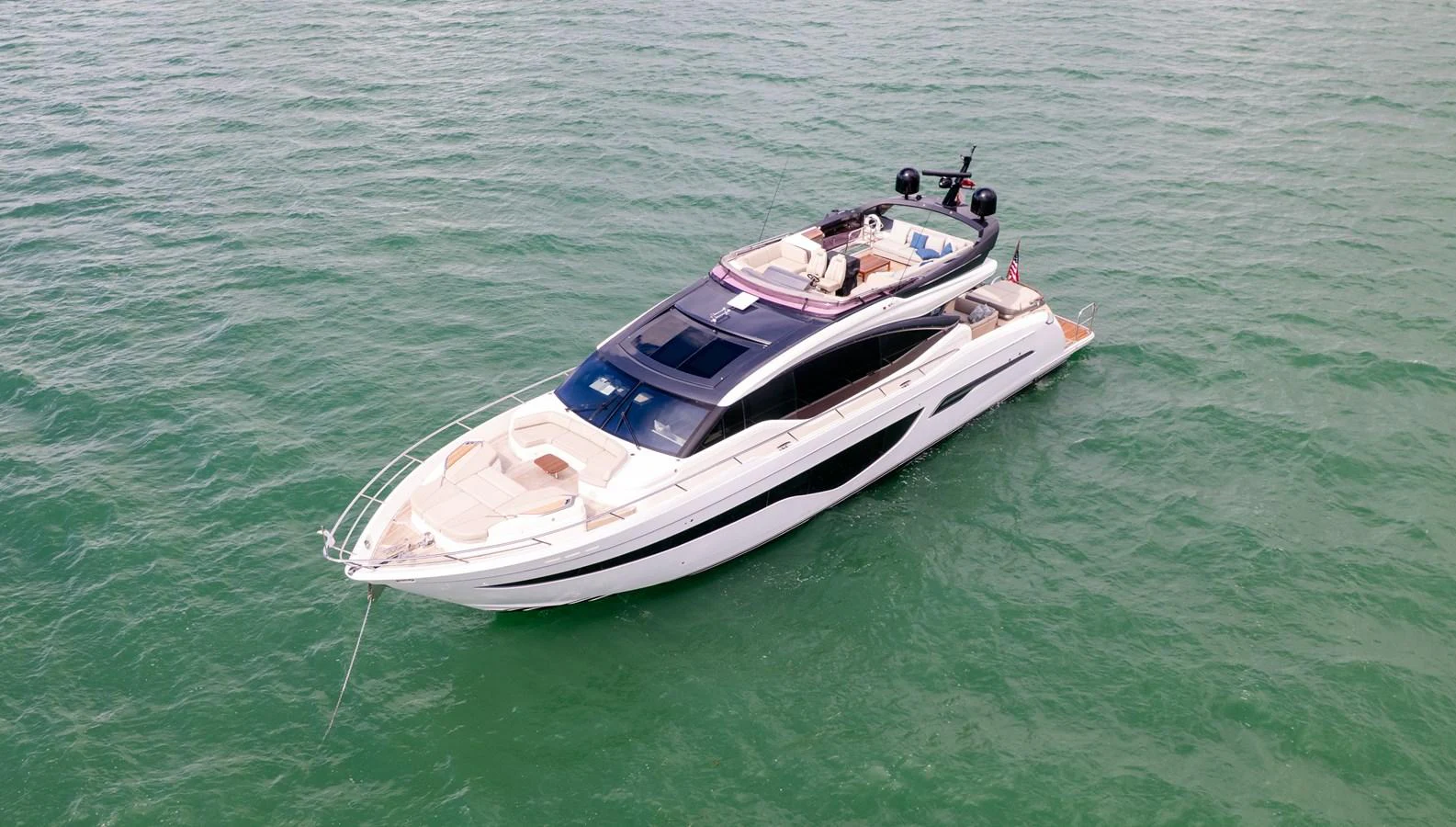 A sleek and modern yacht glides gracefully on calm waters. aboard PARAGON Yacht for Sale