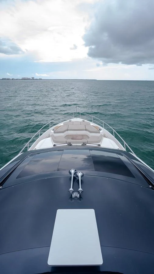 The yacht's bow offers a sleek and inviting space for relaxation with a stunning view of the open sea. aboard PARAGON Yacht for Sale