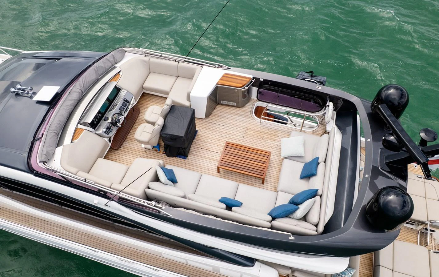 The flybridge offers a spacious seating area with plush cushions and a well-equipped helm station. aboard PARAGON Yacht for Sale