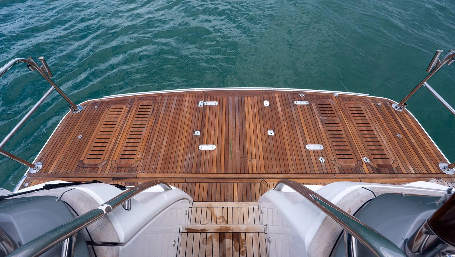The yacht features a spacious teak swim platform, perfect for easy water access. aboard PARAGON Yacht for Sale
