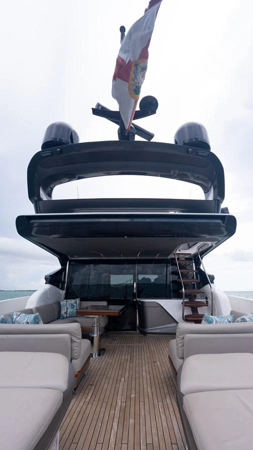 The aft deck features comfortable seating and a dining area, perfect for relaxation and socializing. aboard PARAGON Yacht for Sale