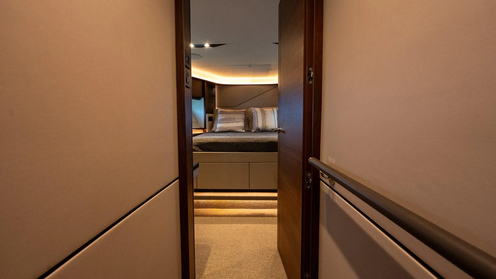 A cozy stateroom with warm lighting and a comfortable bed. aboard PARAGON Yacht for Sale