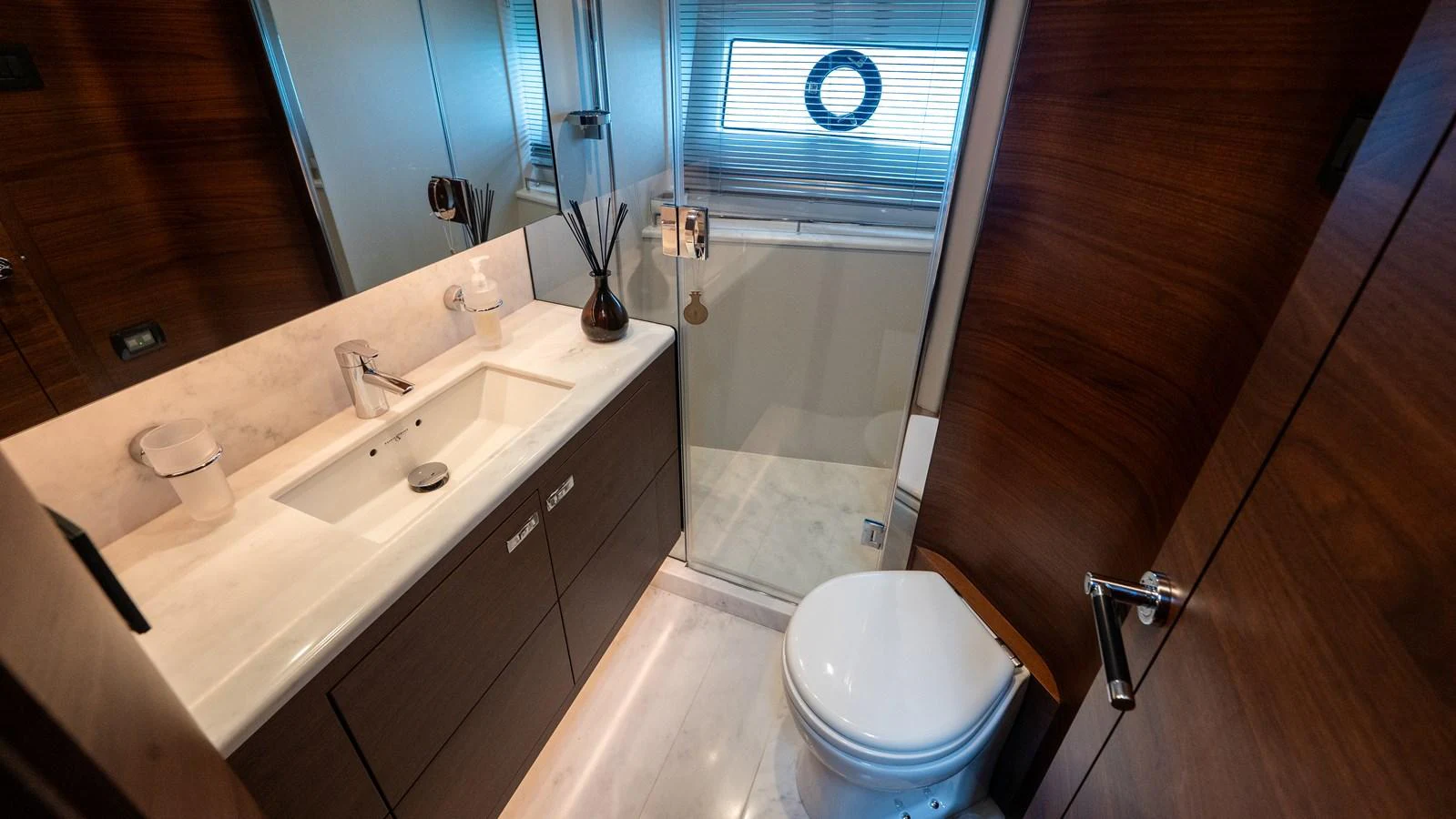 A sleek and modern bathroom with a glass-enclosed shower and elegant fixtures. aboard PARAGON Yacht for Sale
