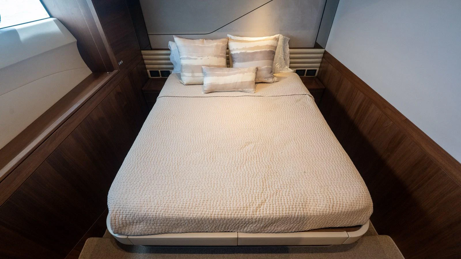 A cozy stateroom featuring a comfortable bed with elegant bedding. aboard PARAGON Yacht for Sale