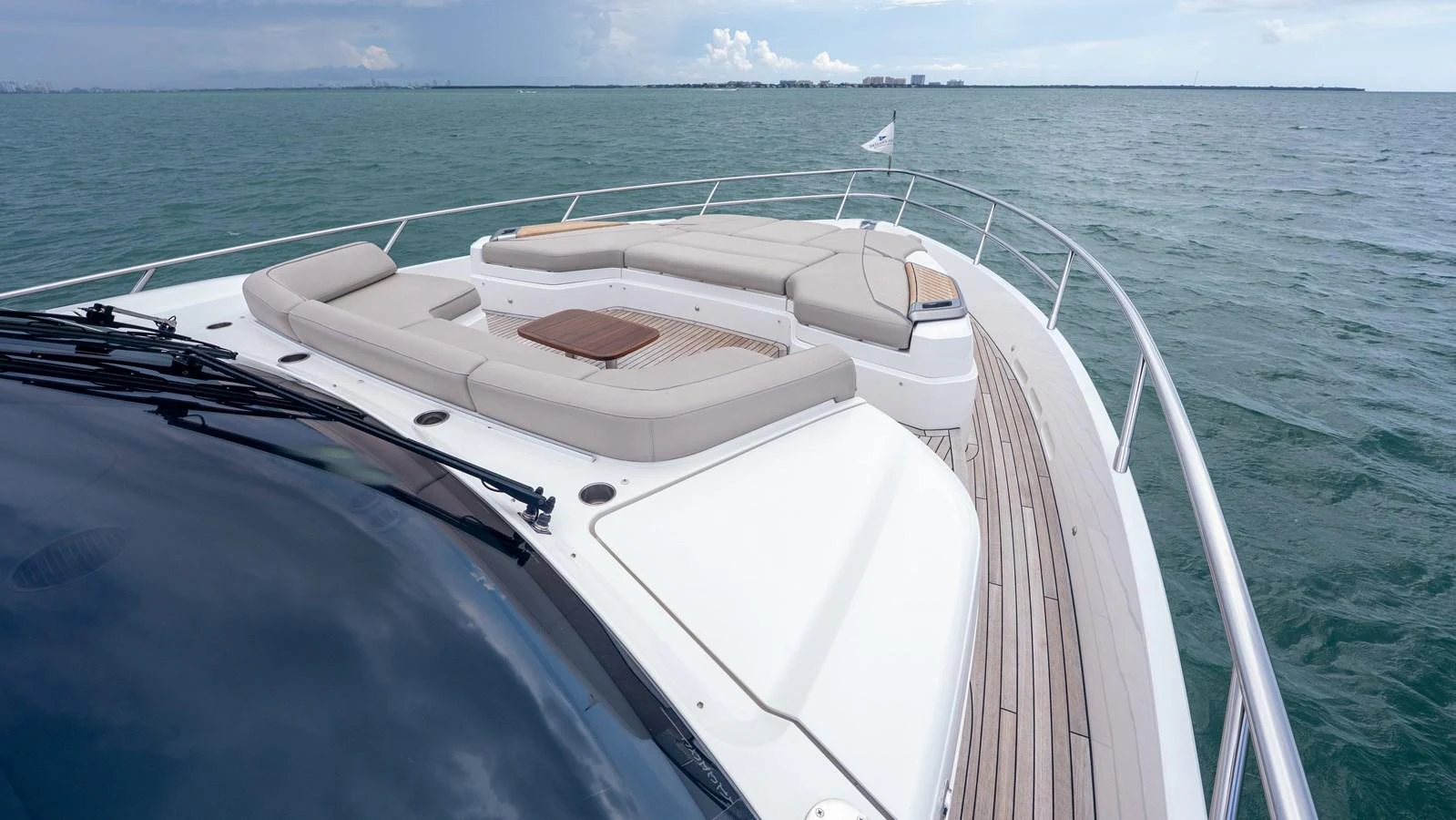 The yacht's foredeck features spacious sun pads and a sleek design, perfect for relaxation. aboard PARAGON Yacht for Sale